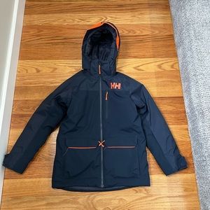 Helly Hansen lightly used, insulated ski jacket.Dark navy with orange. Boys 12